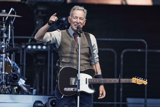 FILE - Bruce Springsteen appears during a concert with the E Street Band in Berlin, Germany, on June 11, 2025. (AP Photo/Markus Schreiber, File)
