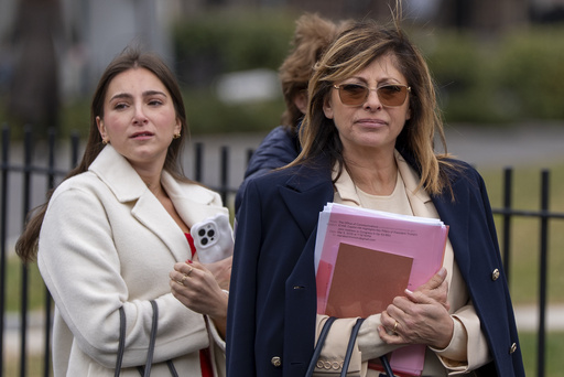 FILE - FOX Business Network anchor Maria Bartiromo, right, arrives at the White House, March 6, 2025, in Washington. (AP Photo/Alex Brandon, File)