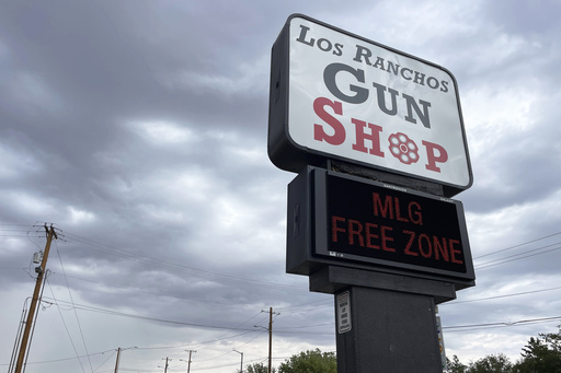 FILE - The marquee at a gun shop in Los Ranchos, N.M, flashes in protest of Gov. Michelle Lujan Grisham's order to suspend the carrying of firearms in the state's largest metro area, Sept. 11, 2023. (AP Photo/Susan Montoya Bryan, File)