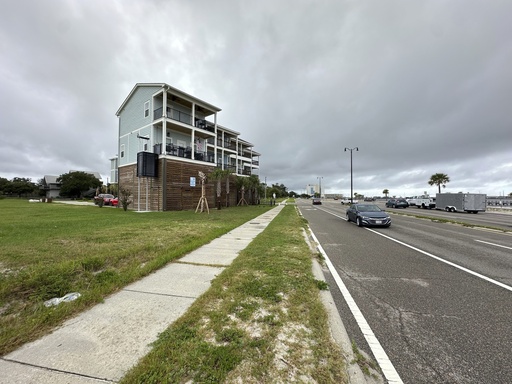Elevated new houses stand west of downtown Aug. 12, 2025, in Gulfport, Miss. (AP Photo/Jeff Amy)