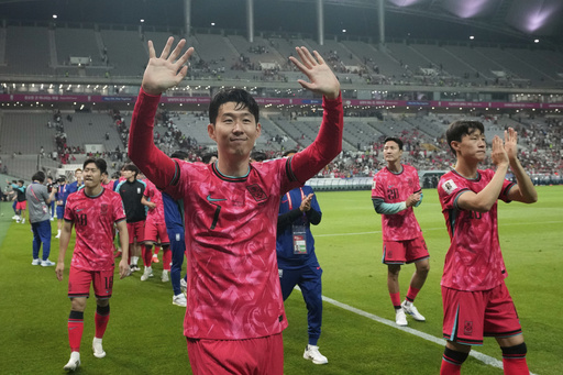 FILE - South Korea's Son Heung-min, left, and his teammates celebrate their advance to the 2026 FIFA World Cup finals after the Asian qualifier group B match for 2026 World Cup between South Korea and Kuwait at Seoul World Cup Stadium in Seoul, South Korea, June 10, 2025. (AP Photo/Ahn Young-joon, File)