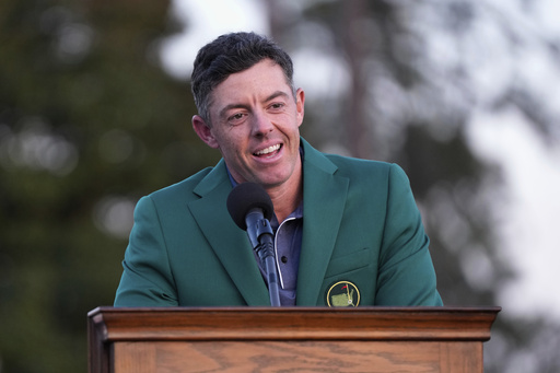 FILE - Rory McIlroy, of Northern Ireland, speaks after putting on the Masters green jacket after winning the Masters golf tournament on April 13, 2025, in Augusta, Ga. (AP Photo/David J. Phillip, File)