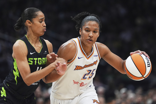 Seattle Storm guard Skylar Diggins, left, defends against Phoenix Mercury forward Alyssa Thomas (25) during the first half of a WNBA basketball game Sunday, Aug. 17, 2025, in Seattle. (AP Photo/Lindsey Wasson)
