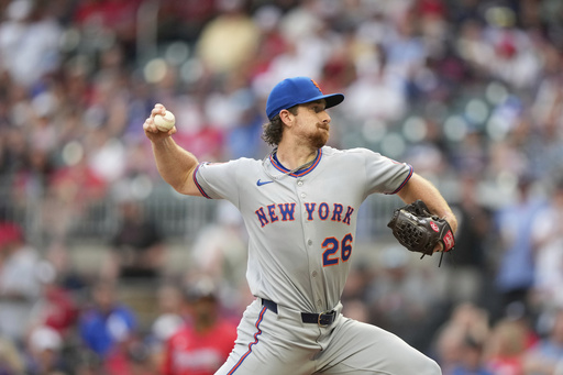 New York Mets pitcher Nolan McLean (26) delivers in the first inning of a baseball game against the Atlanta Braves, Friday, Aug. 22, 2025, in Atlanta. (AP Photo/Brynn Anderson)