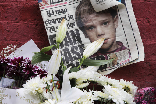 FILE - A newspaper with a photograph of Etan Patz is seen on May 28, 2012, at a makeshift memorial in the SoHo neighborhood of New York, where Patz lived before his disappearance on May 25, 1979. (AP Photo/Mark Lennihan, File)
