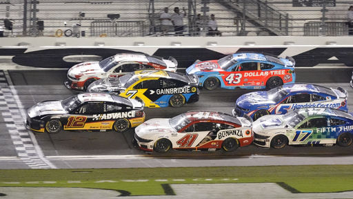 Ryan Blaney (12) crosses the finish line to win a NASCAR Cup Series auto race ahead of at Daytona International Speedway, Saturday, Aug. 23, 2025, in Daytona Beach, Fla. (AP Photo/John Raoux)