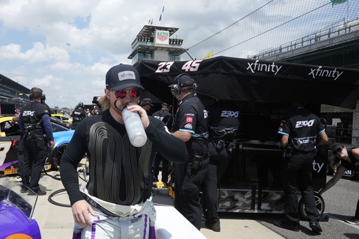 Tyler Reddick takes a drink before a practice session for the NASCAR Cup Series auto race at Indianapolis Motor Speedway, Saturday, July 26, 2025, in Indianapolis. (AP Photo/Darron Cummings)
