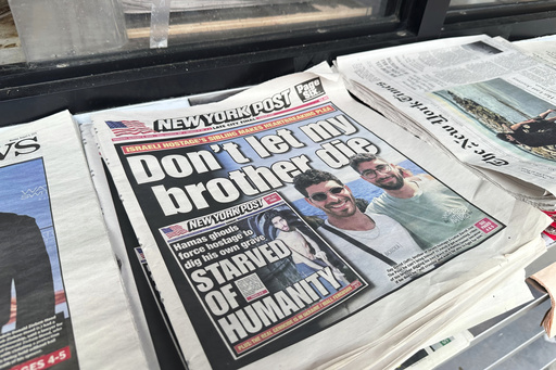 The New York Post is seen at a newsstand in Manhattan, Monday, Aug. 4, 2025. (AP Photo/Jennifer Peltz)
