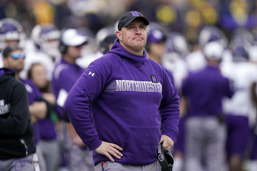 FILE - Northwestern head coach Pat Fitzgerald stands on the sideline during the first half of an NCAA college football game against Michigan, Oct. 23, 2021, in Ann Arbor, Mich. (AP Photo/Carlos Osorio, File)