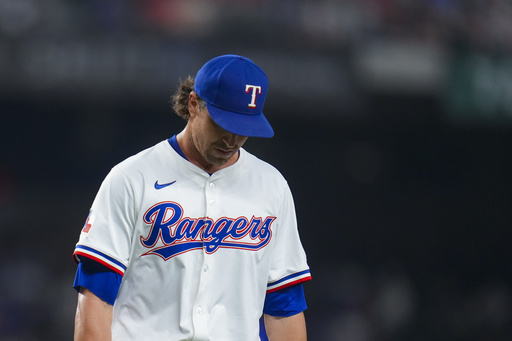 Texas Rangers starting pitcher Jacob deGrom exits the game during the seventh inning of a baseball game against the Philadelphia Phillies Saturday, Aug. 9, 2025, in Arlington, Texas. (AP Photo/Julio Cortez)