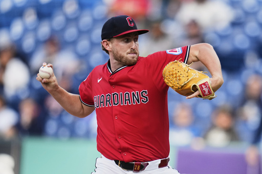 Cleveland Guardians' Tanner Bibee pitches in the first inning of a baseball game against the Tampa Bay Rays in Cleveland, Monday, Aug. 25, 2025. (AP Photo/Sue Ogrocki)