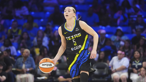 Dallas Wings guard Paige Bueckers (5) dribbles during the first half of a WNBA basketball game against the Los Angeles Sparks in Arlington, Texas, Friday, Aug. 15, 2025. (AP Photo/LM Otero)