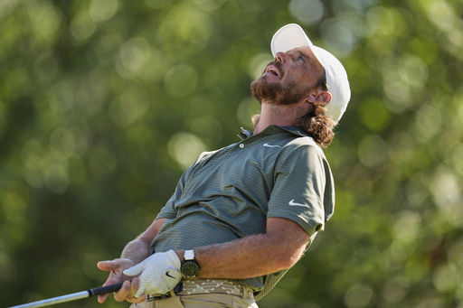 Tommy Fleetwood, of England, reacts to his tee shot on the 18th hole during the third round of the St. Jude Championship golf tournament Saturday, Aug. 9, 2025, in Memphis, Tenn. (AP Photo/George Walker IV)