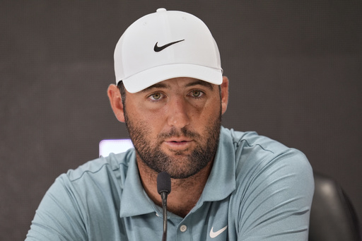 Scottie Scheffler speaks during a news conference after a practice round at the St. Jude Championship golf tournament Wednesday, Aug. 6, 2025, in Memphis, Tenn. (AP Photo/George Walker IV)