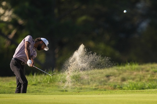 Akshay Bhatia hits out of the bunker on the second hole during the first round of the St. Jude Championship golf tournament Thursday, Aug. 7, 2025, in Memphis, Tenn. (AP Photo/George Walker IV)