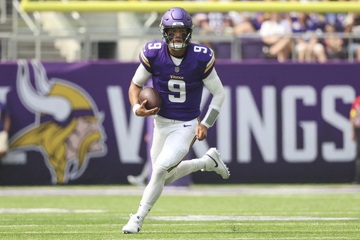 Minnesota Vikings quarterback J.J. McCarthy runs the ball during the first half of an NFL preseason football game against the Houston Texans, Saturday, Aug. 9, 2025, in Minneapolis. (AP Photo/Matt Krohn)