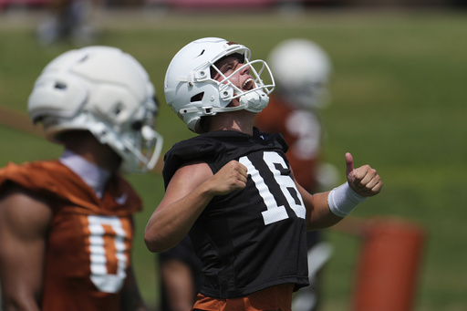Texas quarterback Arch Manning (16) reacts during an NCAA college football practice in Austin, Texas, Wednesday, July 30, 2025. (AP Photo/Eric Gay)