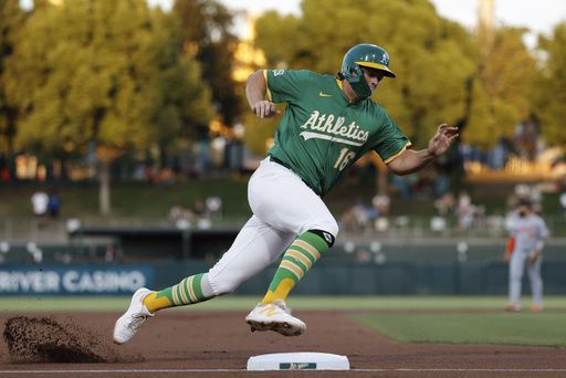 Athletics' Nick Kurtz rounds third base before scoring during the first inning of a baseball game against the Detroit Tigers Wednesday, Aug. 27, 2025, in West Sacramento, Calif. (AP Photo/Sergio Estrada)