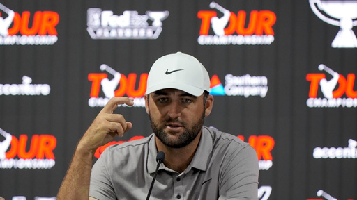 Scottie Scheffler speaks before a practice round of the Tour Championship golf tournament, Wednesday, Aug. 20, 2025, in Atlanta. (AP Photo/Mike Stewart)