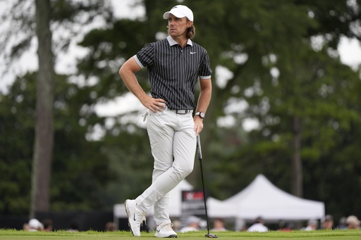 Tommy Fleetwood, of England, waits to putt on the third green during the second round of the Tour Championship golf tournament, Friday, Aug. 22, 2025, in Atlanta. (AP Photo/Mike Stewart)