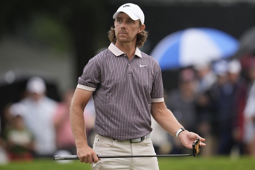 Tommy Fleetwood, of England, walks off the 11th green during the third round of the Tour Championship golf tournament, Saturday, Aug. 23, 2025, in Atlanta. (AP Photo/Mike Stewart)