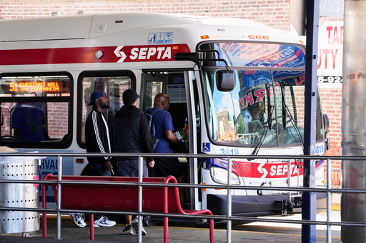 Passengers board a Southeastern Pennsylvania Transportation Authority (SEPTA) bus in Philadelphia, Monday, Aug. 25, 2025. (AP Photo/Matt Rourke)