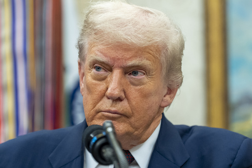 President Donald Trump pauses while speaking during an announcement about Apple with Apple CEO Tim Cook in the Oval Office, Wednesday, Aug. 6, 2025, in Washington. (AP Photo/Alex Brandon)