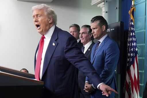 President Donald Trump, from left, speaks with reporters as Army Secretary Dan Driscoll, Interior Secretary Doug Burgum and Defense Secretary Pete Hegseth listen in the James Brady Press Briefing Room at the White House, Monday, Aug. 11, 2025, in Washington. (AP Photo/Mark Schiefelbein)