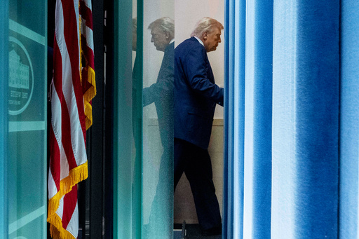 President Donald Trump departs after speaking with reporters in the James Brady Press Briefing Room at the White House, Monday, Aug. 11, 2025, in Washington. (AP Photo/Alex Brandon)