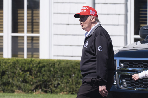 President Donald Trump walks at the Trump National Golf Club in Sterling, Va., Saturday, Aug. 30, 2025. (AP Photo/Manuel Balce Ceneta)