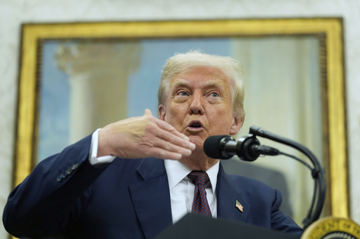 President Donald Trump makes an announcement about Apple with Apple CEO Tim Cook in the Oval Office, Wednesday, Aug. 6, 2025, in Washington. (AP Photo/Alex Brandon)