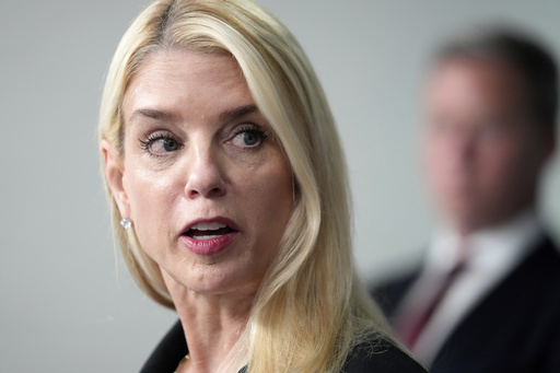 Attorney General Pam Bondi speaks with reporters during a briefing with President Donald Trump in the James Brady Press Briefing Room at the White House, Monday, Aug. 11, 2025, in Washington. (AP Photo/Mark Schiefelbein)