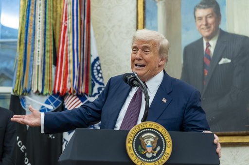 President Donald Trump speaks while making an announcement about Apple with Apple CEO Tim Cook in the Oval Office, Wednesday, Aug. 6, 2025, in Washington. (AP Photo/Alex Brandon)