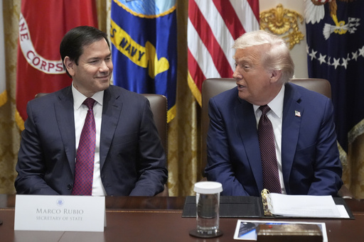 President Donald Trump speaks during a cabinet meeting, Tuesday, Aug. 26, 2025, at the White House in Washington, as Secretary of State Marco Rubio, left, looks on. (AP Photo/Mark Schiefelbein)