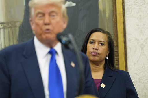 FILE - District of Columbia Mayor Muriel Bowser listens as President Donald Trump speaks during an event to announce that the 2027 NFL Draft will be held on the National Mall, in the Oval Office of the White House, May 5, 2025, in Washington. (AP Photo/Alex Brandon, File)