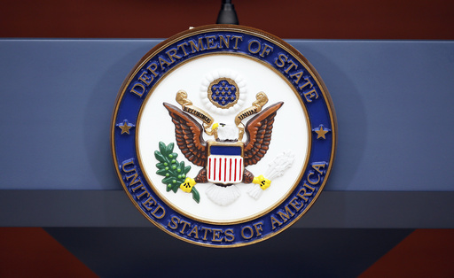 FILE - The seal of the State Department is photographed at the Washington Passport Agency, July 12, 2016, in Washington. (AP Photo/Alex Brandon, File)