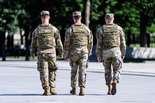 West Virginia National Guard soldiers patrol near the Lincoln Memorial on the National Mall in Washington, as part of President Donald Trump's order to use federal law enforcement to expel homeless people and rid the nation's capital of violent crime, Monday, Aug. 25, 2025. (AP Photo/J. Scott Applewhite)