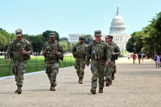 National Guardsmen patrol near the U.S. Capitol, Friday, Aug. 22, 2025, in Washington. (AP Photo/Rahmat Gul)