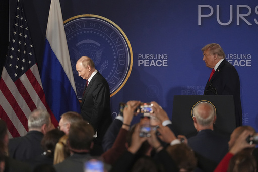 President Donald Trump, right, and Russia's President Vladimir Putin depart at the conclusion of a joint press conference at Joint Base Elmendorf-Richardson, Alaska, Friday, Aug. 15, 2025. (AP Photo/Jae C. Hong)