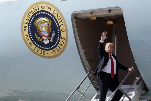 FILE - President Donald Trump waves after greeting troops at Joint Base Elmendorf-Richardson for a refueling stop en route to Japan, May 24, 2019, in Anchorage. (AP Photo/Evan Vucci, File)