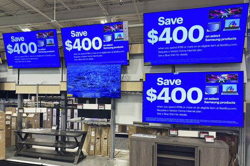 Flat screen TVs are displayed at a retail store in Vernon Hills, Ill., Thursday, Aug. 7, 2025. (AP Photo/Nam Y. Huh)