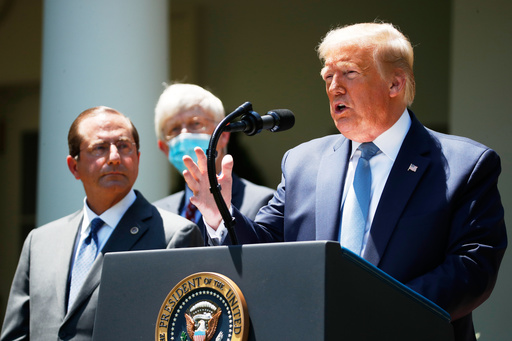 FILE - President Donald Trump speaks about the coronavirus in the Rose Garden of the White House, May 15, 2020, in Washington. Department of Health and Human Services Secretary Alex Azar, left, and Dr. Robert Redfield, director of the Centers for Disease Control and Prevention listen. (AP Photo/Alex Brandon, File)
