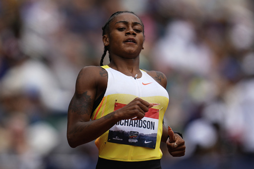 Sha'Carri Richardson competes in the first heat of the women's 200-meter semifinal at the U.S. Championships athletics meet in Eugene, Ore., Sunday, Aug. 3, 2025. (AP Photo/Abbie Parr)