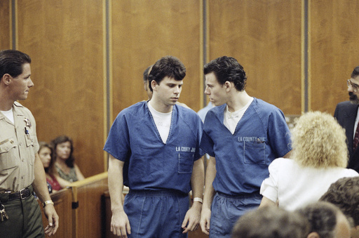 FILE - Lyle, left, and Erik Menendez leave a courtroom in Santa Monica, Calif., Aug. 6, 1990, after a judge ruled that conversations between the brothers and their psychologist after their parents were slain were not privileged and could be used as evidence. (AP Photo/Nick Ut, File)