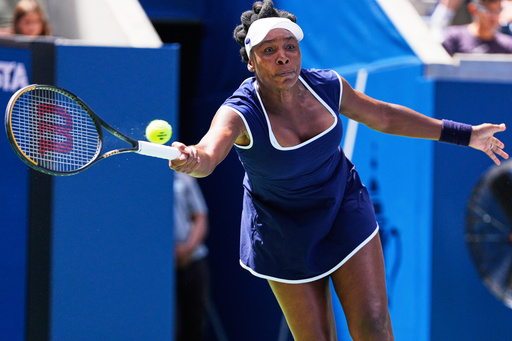 Venus Williams returns a shot during the mixed doubles competition of the U.S. Open tennis tournament in New York, Tuesday, Aug. 19, 2025. (AP Photo/Yuki Iwamura)