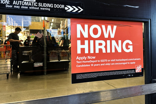 FILE - A hiring sign is displayed at a retail store in Mount Prospect, Ill., Saturday, Nov. 2, 2024. (AP Photo/Nam Y. Huh, File)
