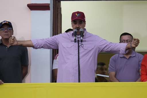 Venezuela's President Nicolas Maduro addresses supporters during an event marking the anniversary of his disputed re-election and the birthday of late President Hugo Chavez, in Caracas, Venezuela, Monday, July 28, 2025. (AP Photo/Ariana Cubillos)
