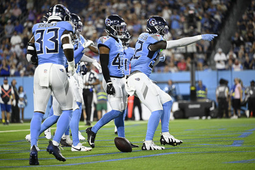 Tennessee Titans linebacker James Williams Sr. (52) celebrates after an interception against the Minnesota Vikings during the first half of a preseason NFL football game, Friday, Aug. 22, 2025, in Nashville, Tenn. (AP Photo/John Amis)