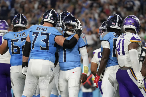 Tennessee Titans quarterback Cam Ward (1) celebrates with guard Blake Hance (73) after a touchdown by running back Julius Chestnut (36) during the first half of a preseason NFL football game against the Minnesota Vikings, Friday, Aug. 22, 2025, in Nashville, Tenn. (AP Photo/George Walker IV)