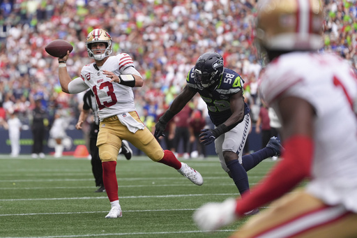 San Francisco 49ers quarterback Brock Purdy (13) throws during the second half of an NFL football game against the Seattle Seahawks, Sunday, Sept. 7, 2025, in Seattle. (AP Photo/Lindsey Wasson)